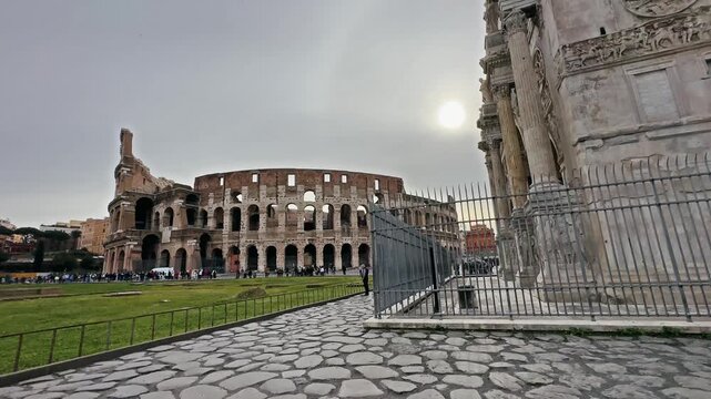 Arch of Constantine and Colosseum at sunrise in Rome, Italy