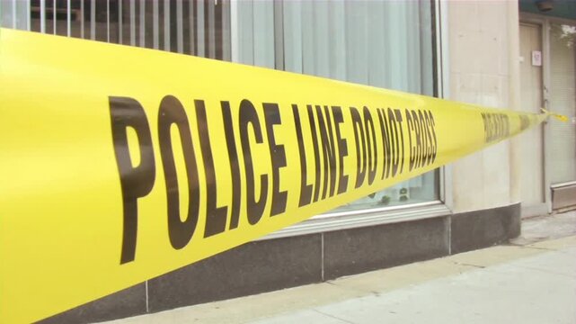 caution sign police line yelow tape do not cross criminal location.
