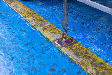 Cargo Securing Ratchet Strap Fixing a Heavy Truck to a Ferry Ship Deck