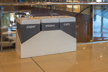 Modern Waste Segregation Bin for Paper Plastic and Cans Inside a Shopping Mall