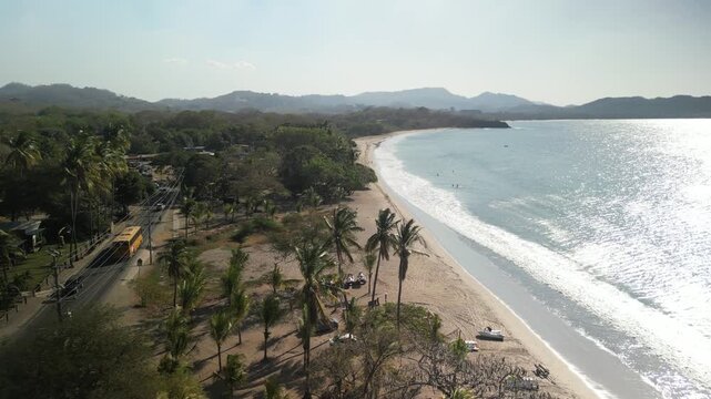 Aerial of Playa Brasilito flying low over water along Pacific Ocean in Costa Rica