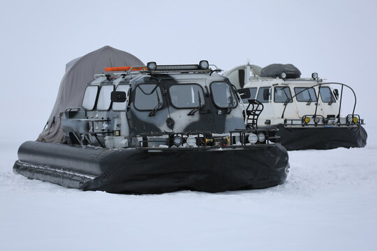 a hovercraft on the ice of a snow-covered lake