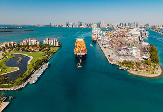 Miami, Florida, USA - April 12, 2025: Freight container on cargo vessel. Cargo ship vessel at port. Port of Miami. MSC Susanna container ship. Cargo ship with container in Miami, aerial view