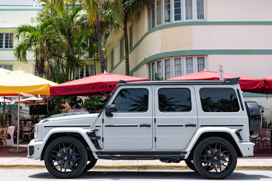 Miami, Florida, USA - July 12, 2025: White car, side view. Mercedes Benz G class SUV pickup truck. Luxury pickup truck Mercedes Benz AMG G class. Car Mercedes Benz AMG G parked outdoor.