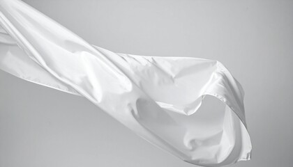 Expressive white drapery waving, isolated on a neutral background. Silk fabric stripes are blown by the wind