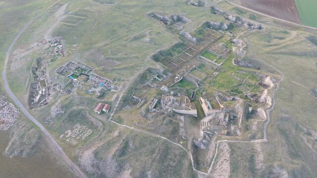 Cinematic aerial drone video of Gordion Ancient City near Polatli in Ankara, Turkey, showcasing the Midas Tumulus, ancient ruins, and wide historical landscape from above.