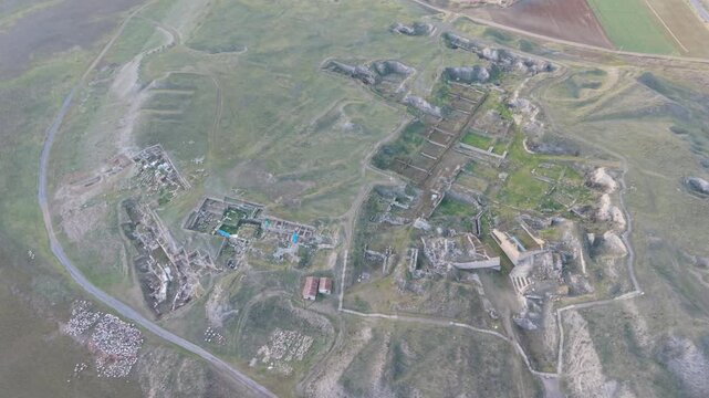 Cinematic aerial drone video of Gordion Ancient City near Polatli in Ankara, Turkey, showcasing the Midas Tumulus, ancient ruins, and wide historical landscape from above.