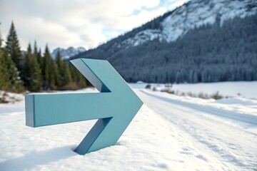 Fototapeta premium Bright blue arrow pointing right embedded in snow on a winter road direction