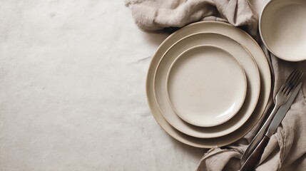 Elegant dining setup with neutral plates.