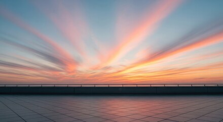 Fototapeta premium Expansive open terrace overlooks the horizon during a vibrant, streaked twilight