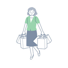 多数のショッピングバッグを持って歩くシニア女性