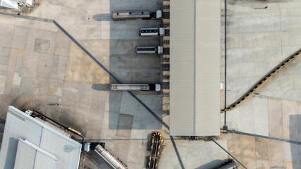 Aerial view of industrial oil storage tank farm and distribution terminal with tanker truck, Fuel reserves and oil refinery infrastructure, Fuel distribution center energy product fuel storage tank.