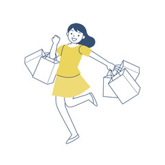 多数のショッピングバッグを持って歩く若い女性