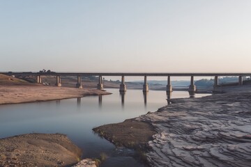 Bridge Over River with Extremely Low Water Level, Severe Drought Concept