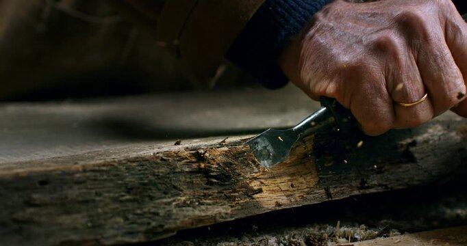 Slow Motion Close Up of Carpenter Using Chisel To Shape Old Wooden Beam at 1000 fps.