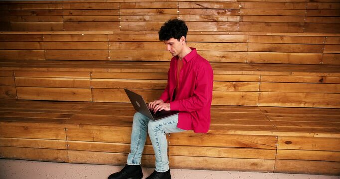 Confident man freelancer using laptop copywriter typing on keyboard. Online technology concept