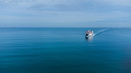 Aerial View of Ferry Boat Sailing on Calm Blue Ocean, Minimalist Seascape with Vast Copy Space
