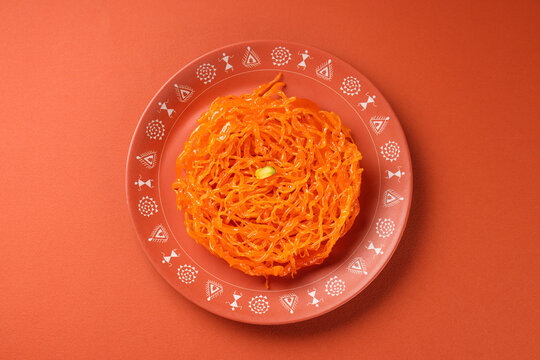 Gorgeous gheeyars, a sweet and crisp sindhi treat serve in plate isolated