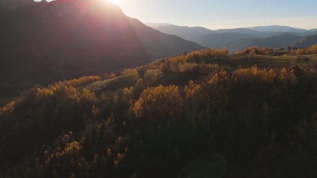 Magnificent Rapid Ascending Aerial Flight Over Golden Autumn Crests Towards the Setting Sun in Poiana Marului Cinematic 4K Graded
