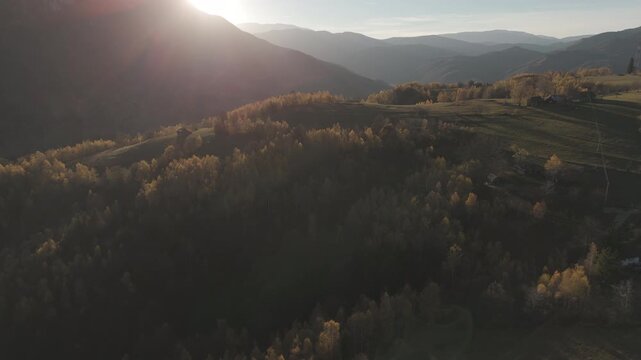 Awe-inspiring Panoramic Aerial Pull Back Over Golden Autumn Hills Towards the Sunset in Poiana Marului Cinematic 4K Ungraded Log