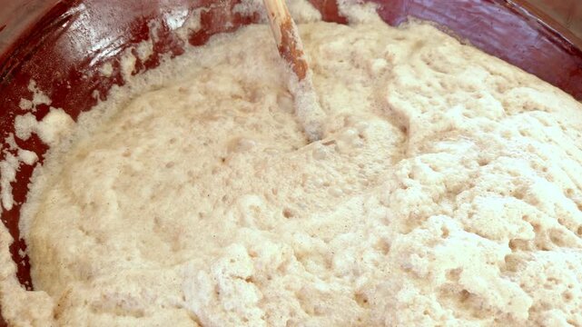 Mixing dough for traditional Cholula festival bread outdoors