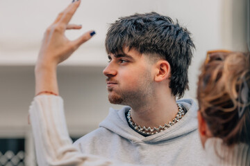 young man huffing and puffing, enduring the reprimand or argument