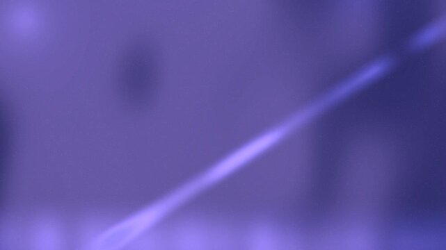 Blurry purple background with diagonal light streak Animation Motion.