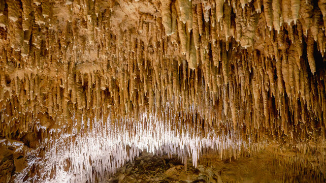 Majestic Stalactites and Stalagmites Speleothems Inside Limestone Cave.