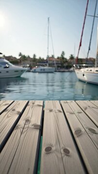 close-up of a wooden pier, with yachts and the sea in the background