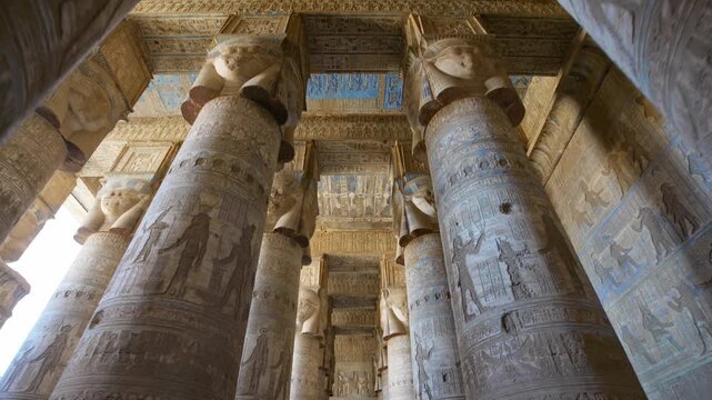 Dendera temple or Temple of Hathor. Painted columns with goddess faces and hieroglyphic ceiling of the hypostyle hall. Downscaled from 6k.