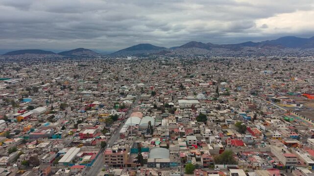 Wide pullback drone view of Ecatepec metropolitan landscape