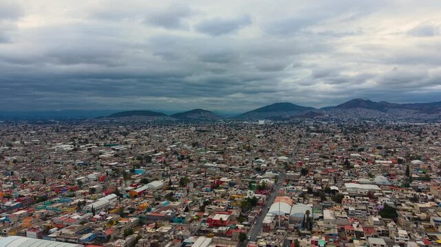 Cinematic drone flight over Ecatepec on a cloudy afternoon