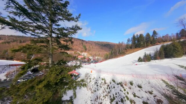 Welcome to Solisko! Winter scenes from an FPV drone, showing skiers and snowboarders on picturesque slopes.