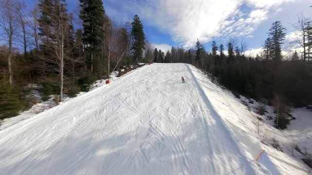 The magic of winter from an FPV drone: skiers and snowboarders on Solisko, Szczyrk, seen from a unique perspective.