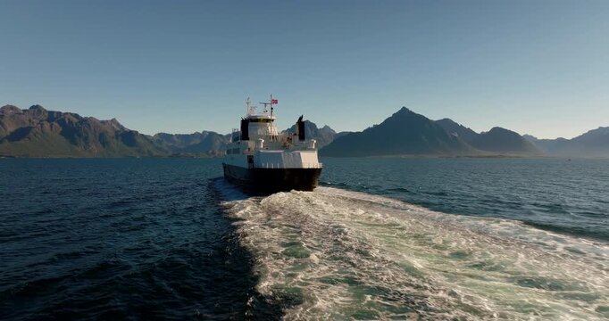 Ferry in Lofoten Islands travel between Fiskebol and Melbu, rear aerial tracking