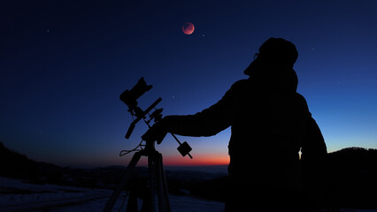 Amateur astronomer observing stars, planets, Moon eclipse and other celestial objects. © astrosystem