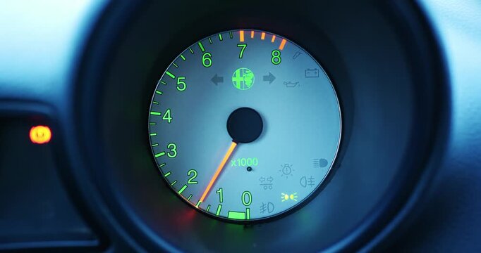 Timisoara, Romania - February 24, 2026: Car dashboard RPM gauge displays increasing engine speed with illuminated warning lights and indicators in a close-up view