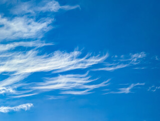 Cirrus horizontal clouds floating across the endless sky. Detailed texture of steam cloud and evaporating moisture. A lone raindrop volumetric structure.