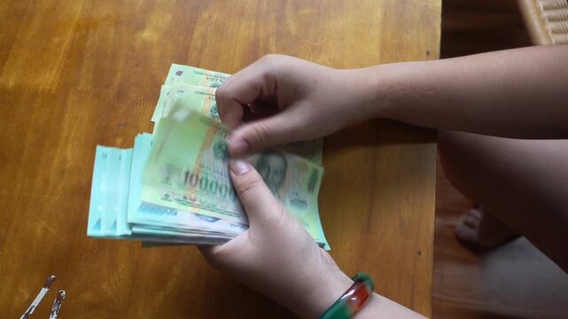 hands counting money, Vietnamese dong banknotes cash 