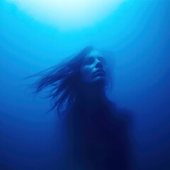 Fototapeta premium A woman with long hair is in the water