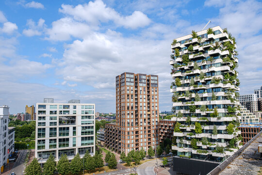 Eindhoven, Netherlands - June 28, 2025: Modern architectural buildings in Strijp S district of Eindhoven showcasing greenery and innovative design with copy space for creative use