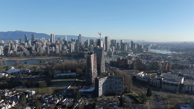 Dense Urban Development Alongside False Creek And Burrard Inlet In Vancouver, British Columbia, Canada. Aerial Shot