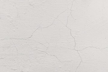 Obraz premium Minimalist white cracked wall texture with subtle plaster lines and weathered surface.