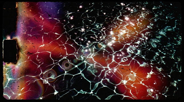 Dark film frame composite showing water caustic patterns in teal and red tones with camera aperture overlay element.