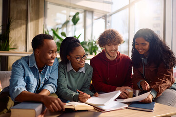 Fototapeta premium Group of happy diverse students learning together at university.