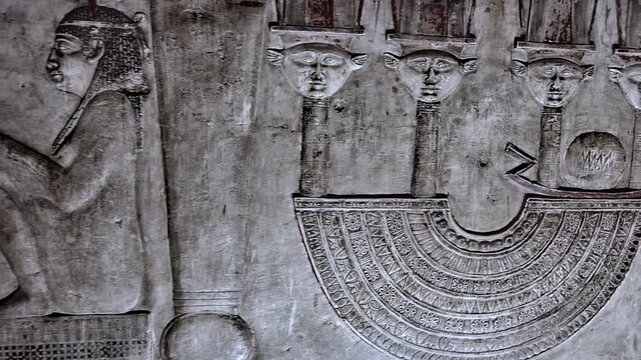 Dendera temple underground crypt corridors with hieroglyphic reliefs on walls in Egypt, narrow ancient passageways with carved inscriptions.