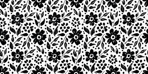 Black and white floral pattern with scattered dots and stylized leaves