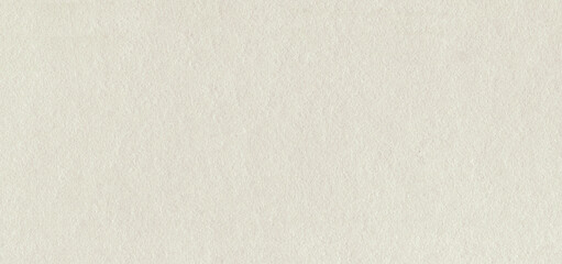 Fototapeta premium Ivory paper texture background. White canvas with speckles. Creamy cardboard with eggshell texture. Ecru rectangle sheet. Vintage beige grunge paper background