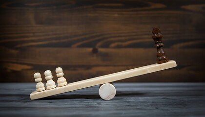 Chess pawns and king on a wooden seesaw symbolizing power imbalance, strategy, leadership and inequality in business decisions featuring balance, tactics, competition with management and hierarchy