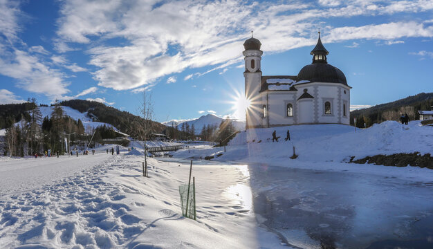 Winter panorama of Seefeld village with the church at sunset in in the Tyrolean Alps, Austria